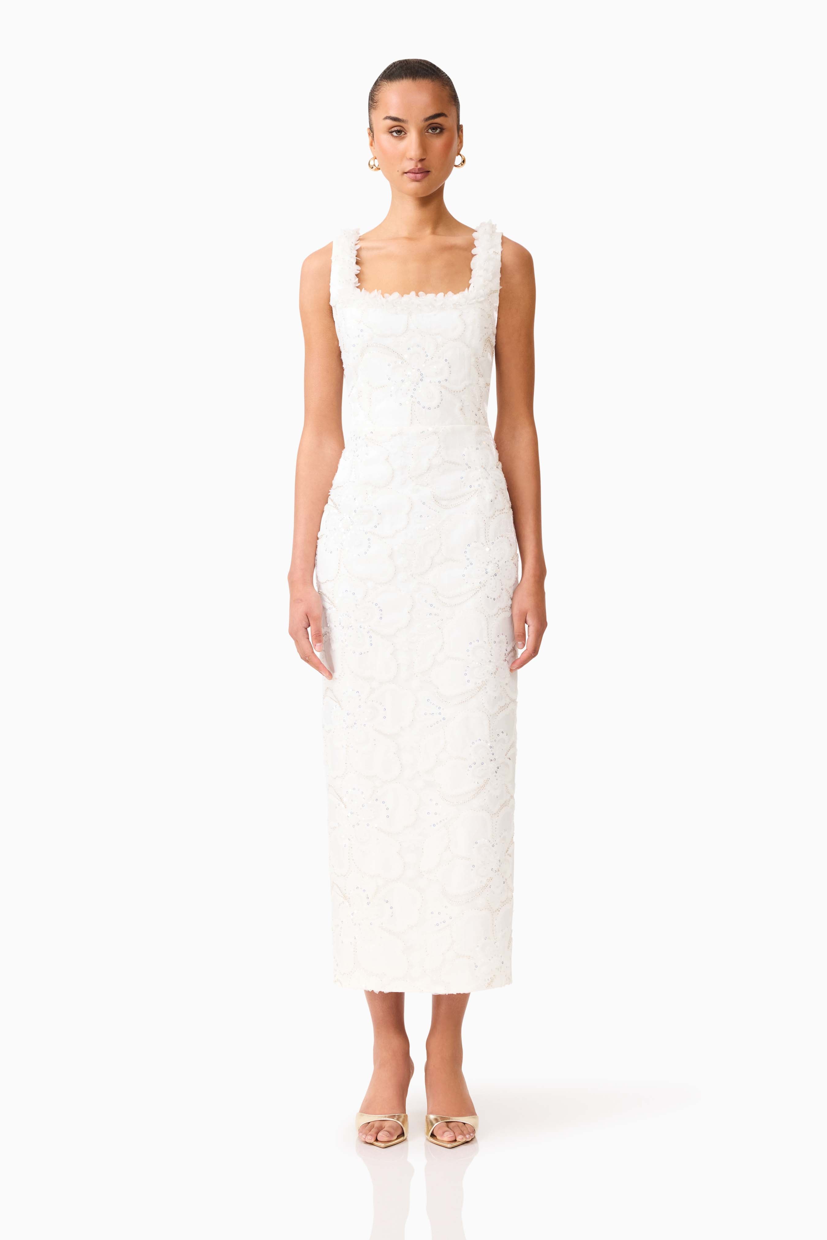 Brunette model wearing the Elowen Floral Applique Midi Dress in White front shot