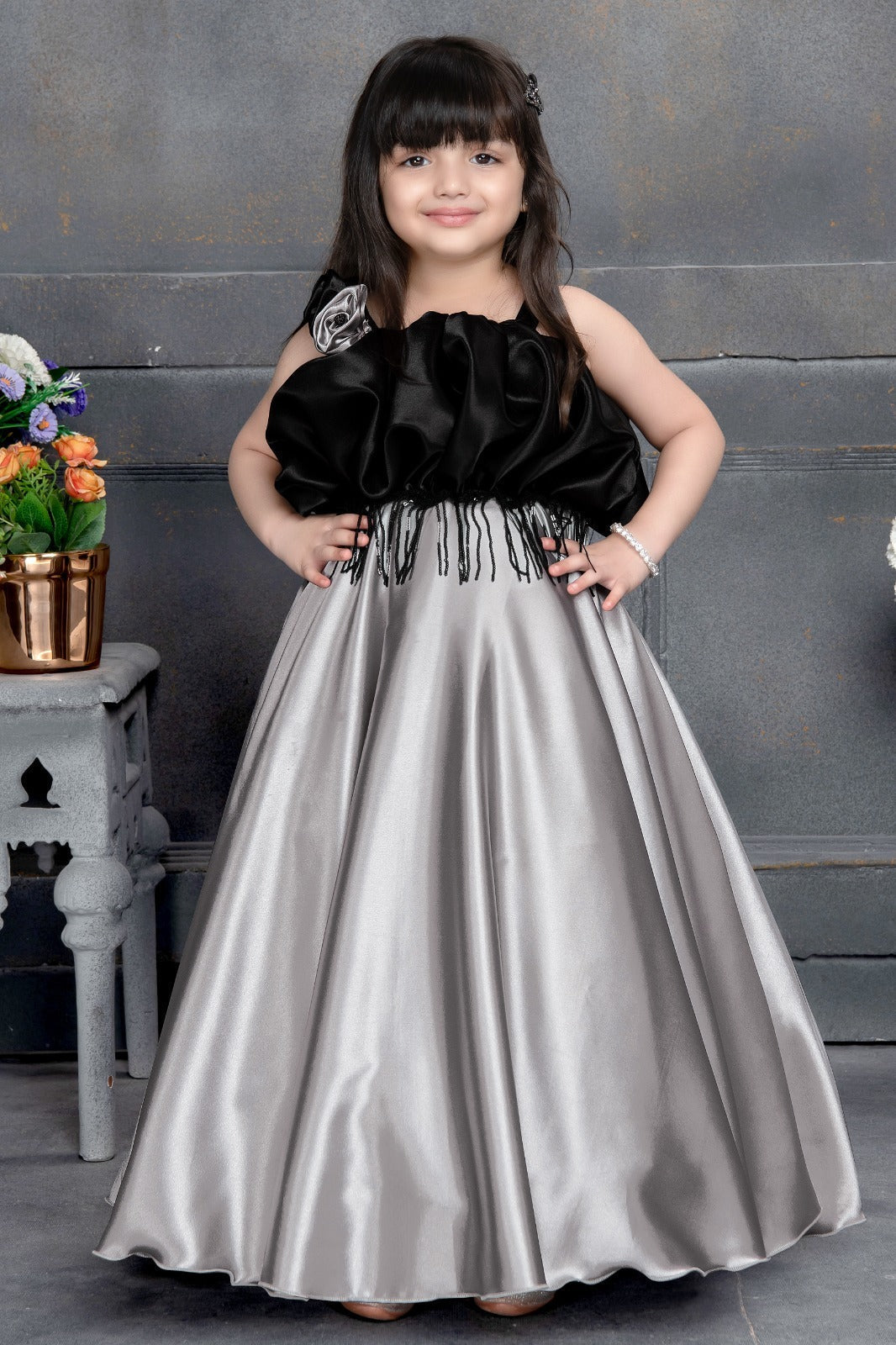 Black and silver satin sleeveless party gown for girls with floral detail