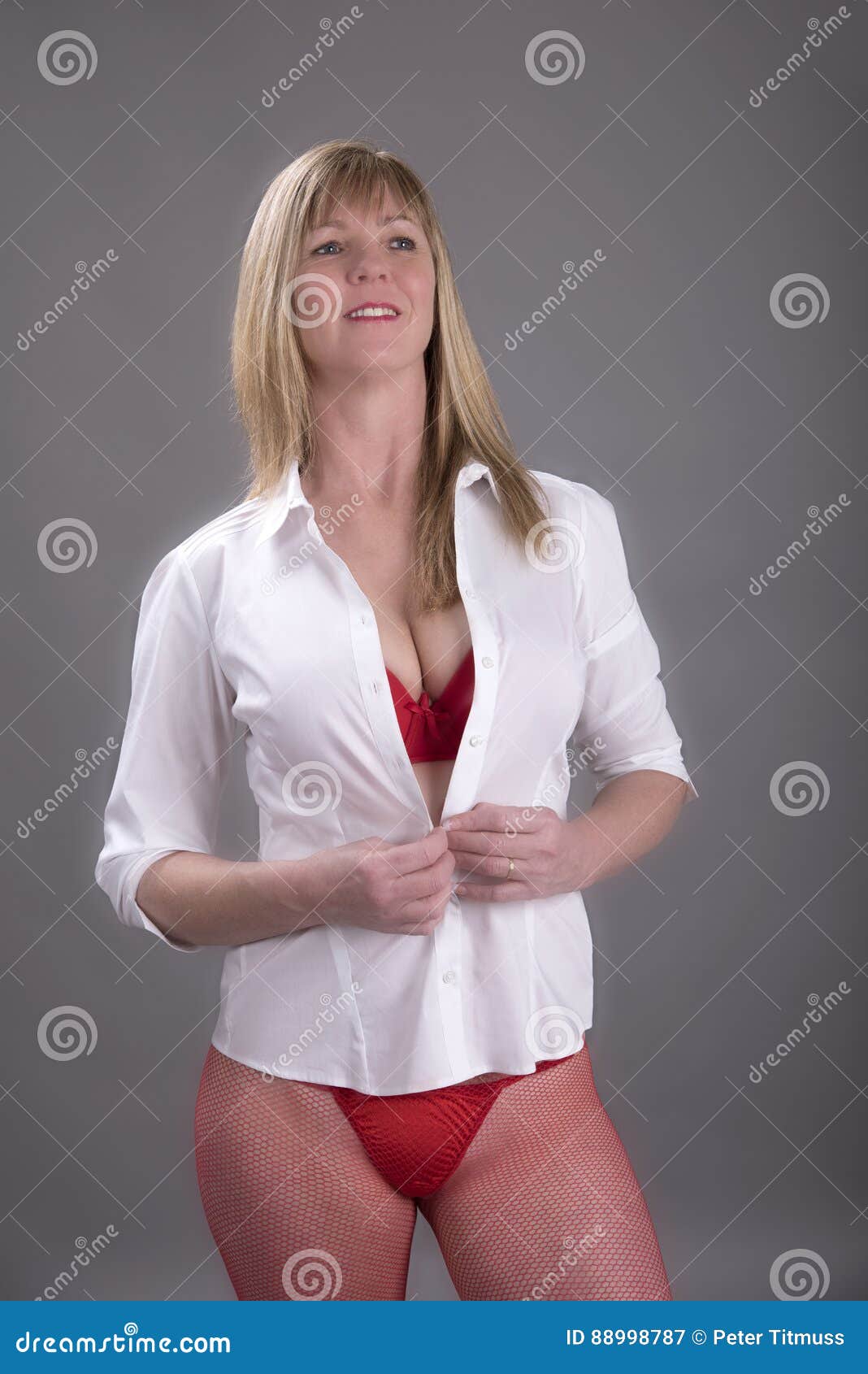 Middle Aged Woman Getting Dressed Stock Photos