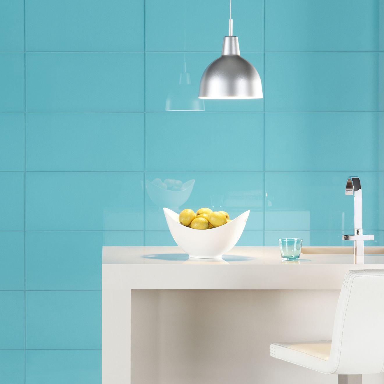 Colorado Clear Glass 600 x 300mm teal glass surface with a white ceramic bowl of lemons