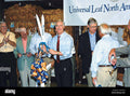 Gov. Mike Easley holds the scissors following a ribbon-cutting ceremony  Friday, Sept. 5, 2003, during the grand opening celebration for the new Universal  Leaf North America U.S. Inc. leaf tobacco processing facility